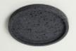 Round dark stone tray with a raised rim, viewed from above