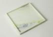 Square pale green stone tray with a narrow raised rim, viewed from above
