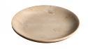 Round beige stone dish with a shallow curved rim, three-quarter view