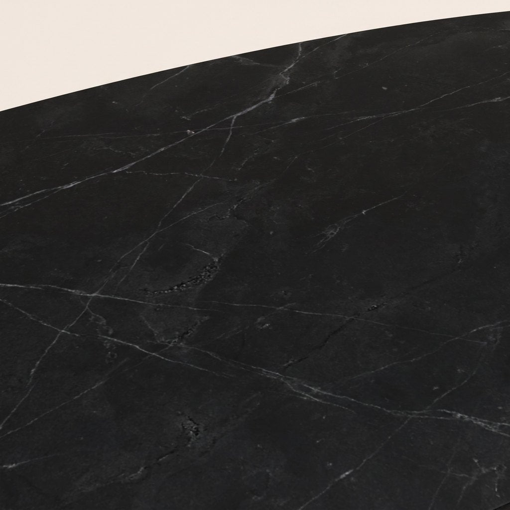 Oval Black Marble Coffee Table — Metal Cross Base: close-up of the black marble surface