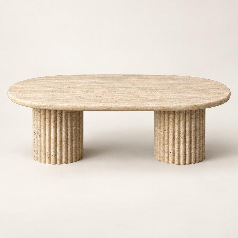 Oval Fluted Travertine Coffee Table in beige, studio view