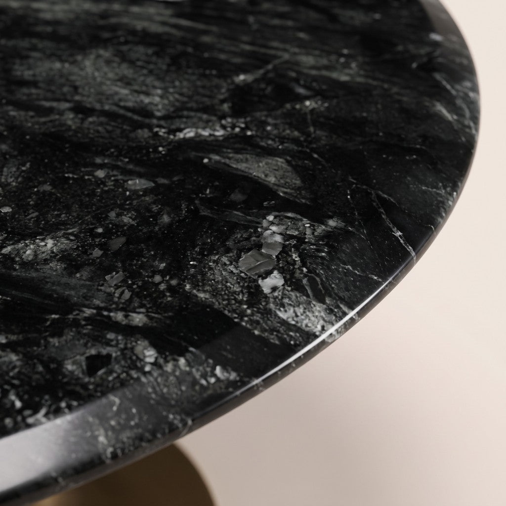 Round Black Marble Dining Table — Brass Tulip Base: close-up of the stone surface