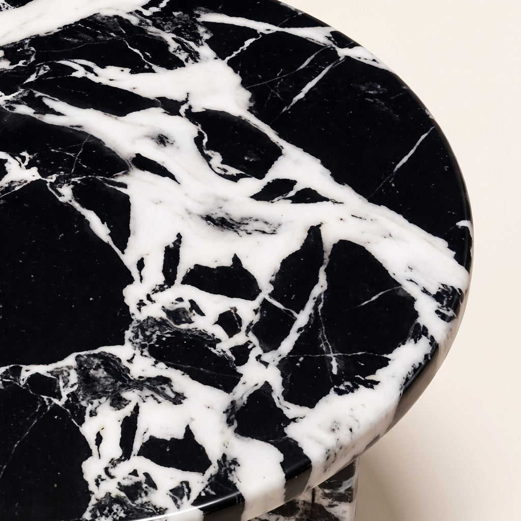 Round Black-and-White Marble Side Table — Cross Base: close-up of the stone surface