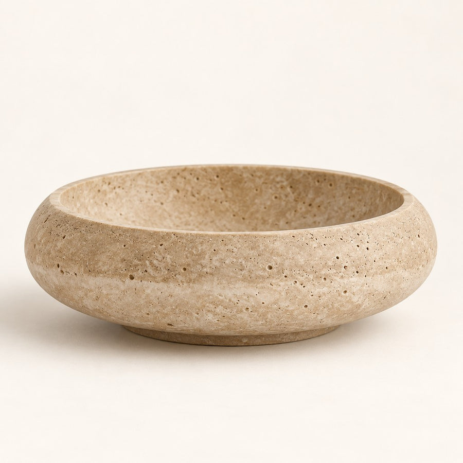 Round Decorative Bowl in Beige Travertine, studio view