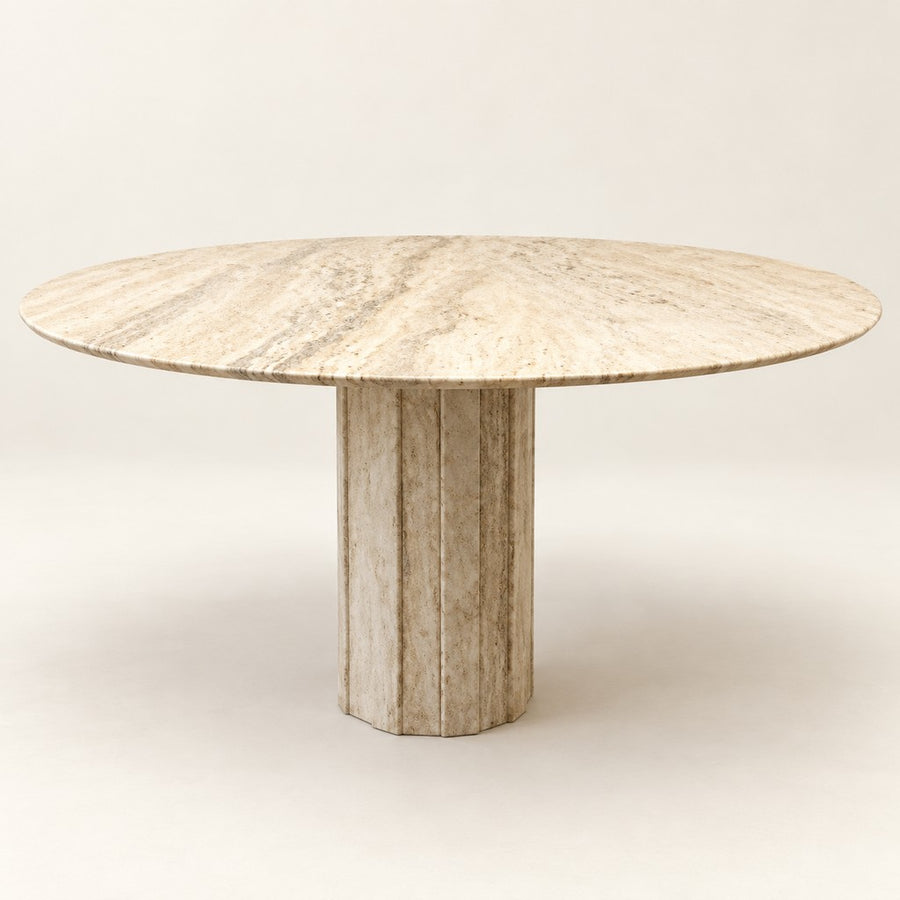 Round Travertine Dining Table — Faceted Pedestal, beige travertine, studio view