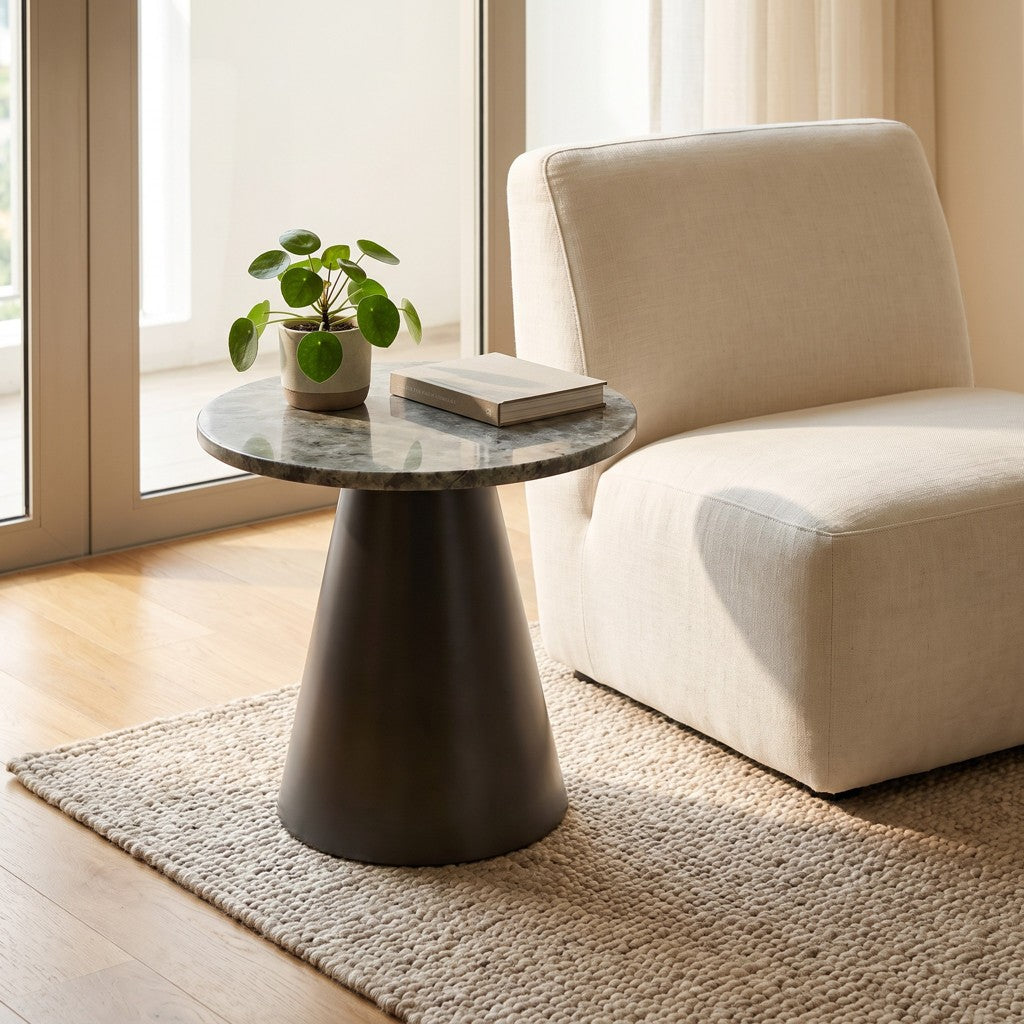 Round Grey Stone Side Table — Cone Base, in a living room