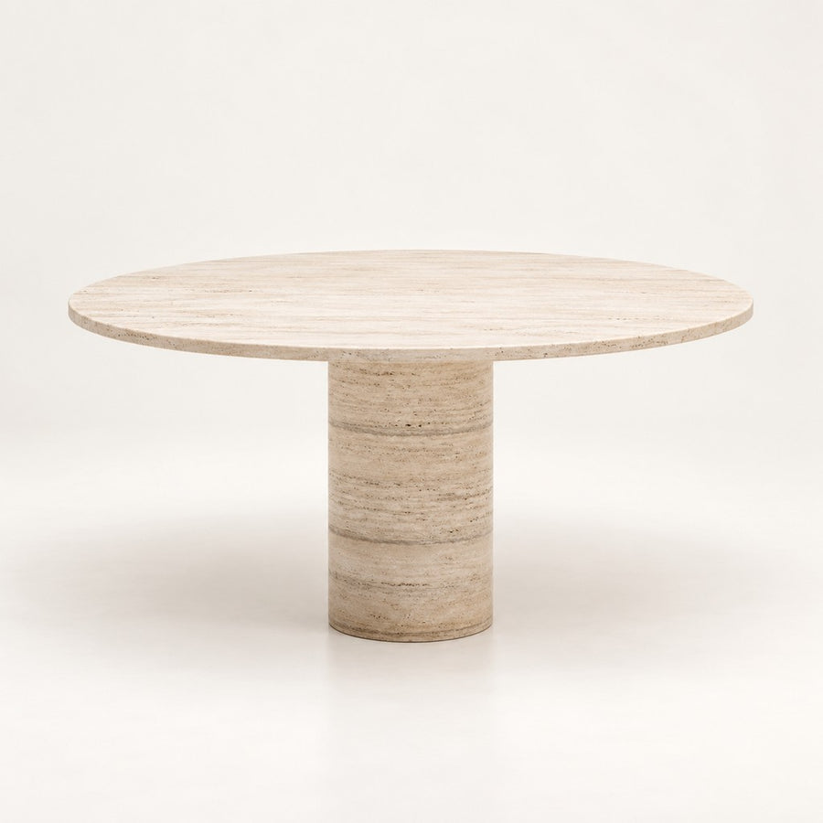 Round Travertine Dining Table — Slim Column Pedestal, beige travertine, studio view