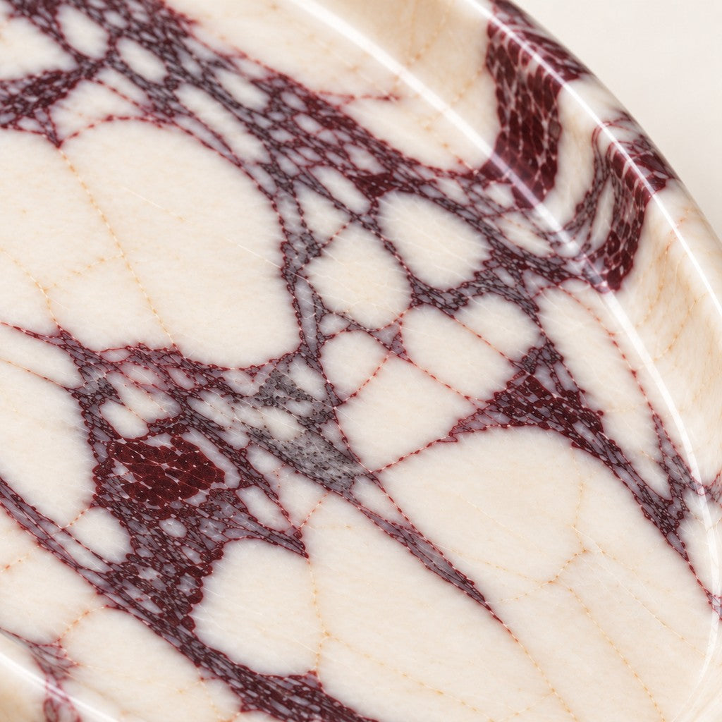 Smooth Pebble Tray: close-up of the Calacatta Viola surface