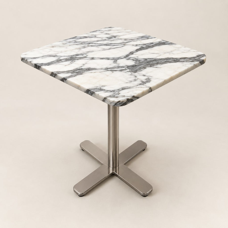 Square Cross-Foot Side Table in Arabescato, studio view