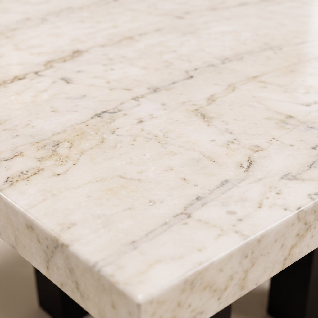 Square Metal-Leg Cream Stone Dining Table: close-up of the stone surface