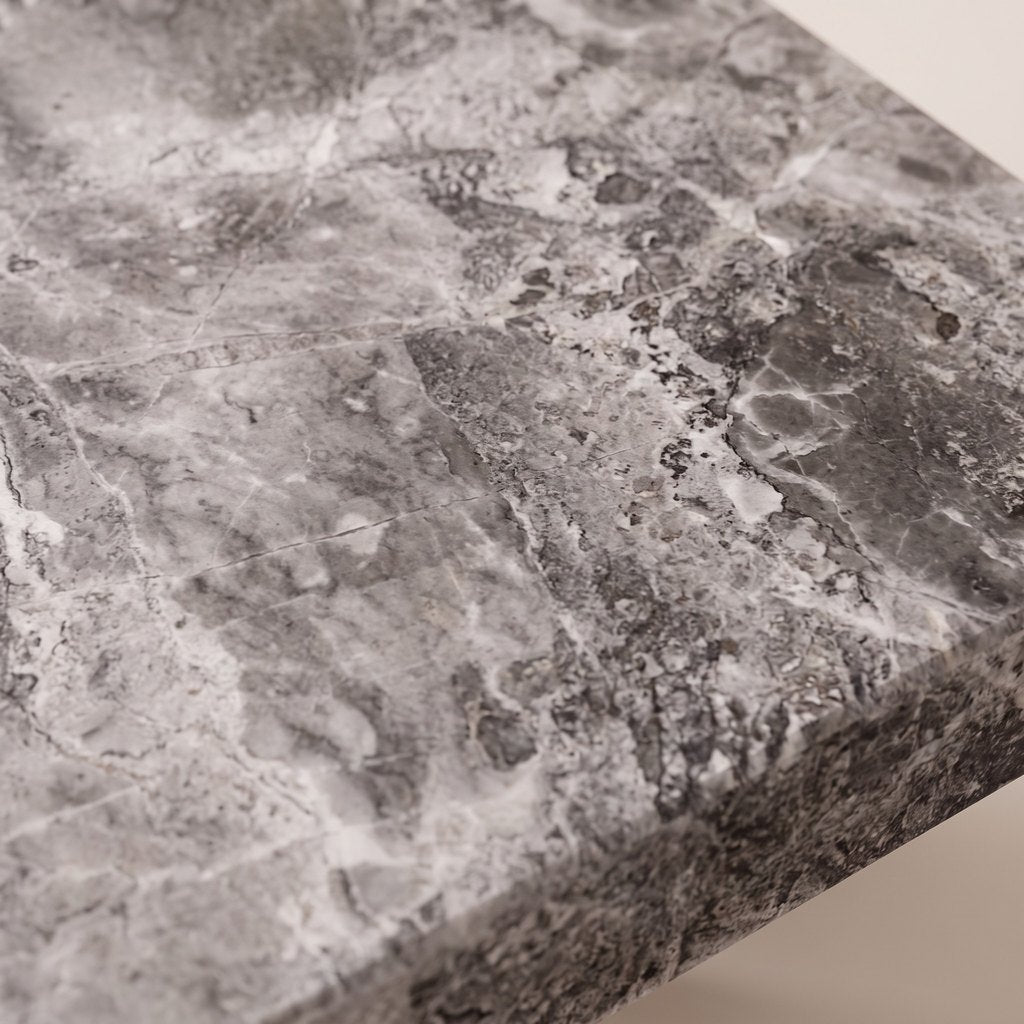 Square Metal-Leg Grey Stone Dining Table: close-up of the grey veined stone surface