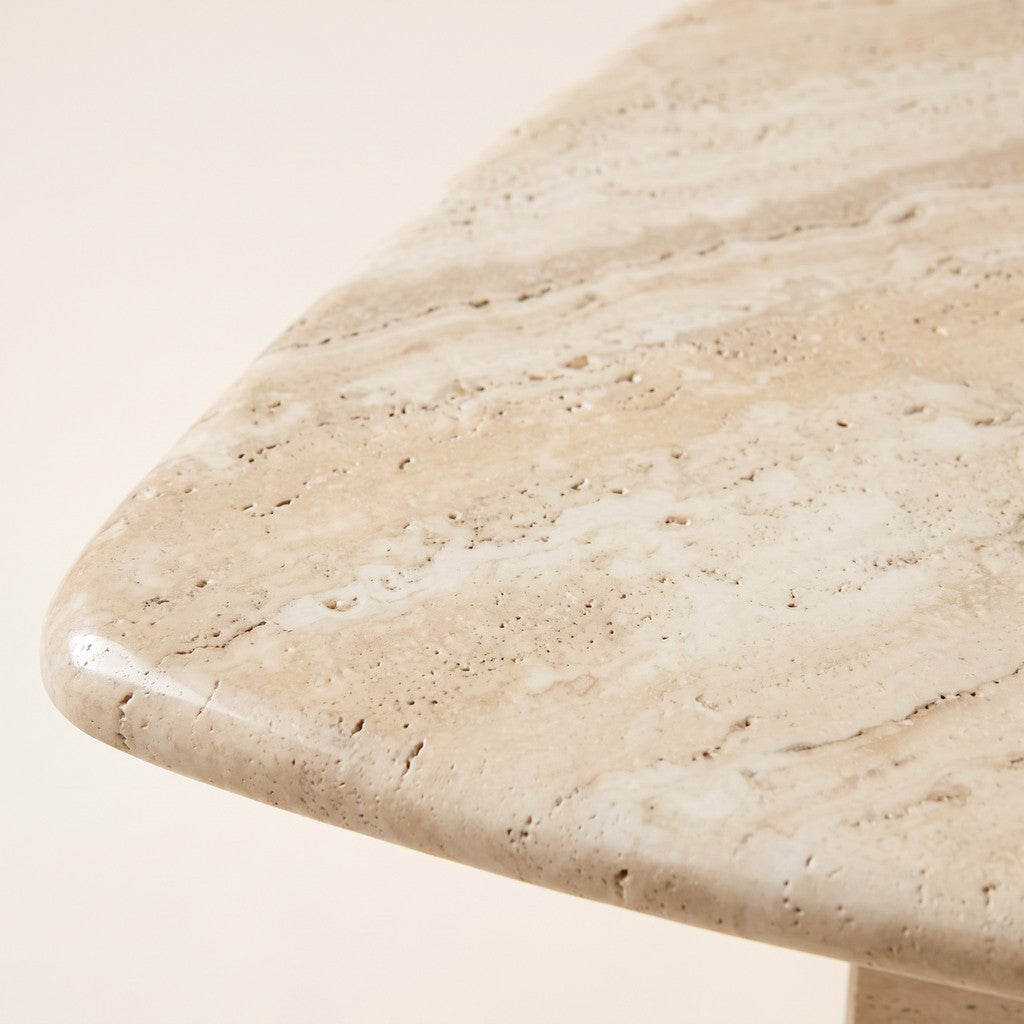 Travertine Coffee Table — 63 × 55 cm: close-up of the travertine surface